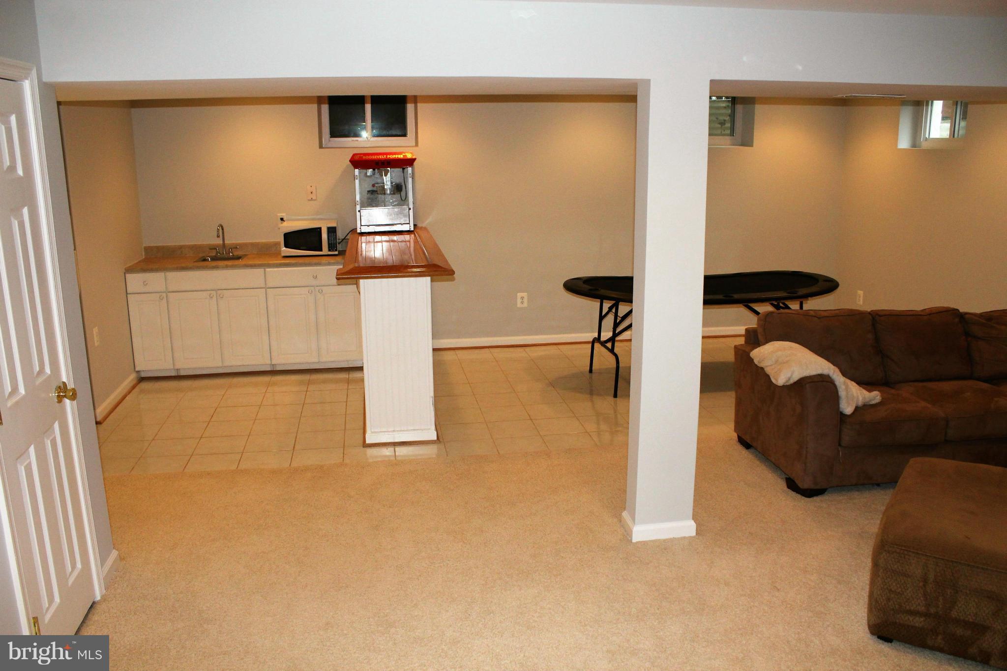 109 Peyton Road Sterling, VA 20165 - Photo 25 of 30 Bar, fridge and sink!