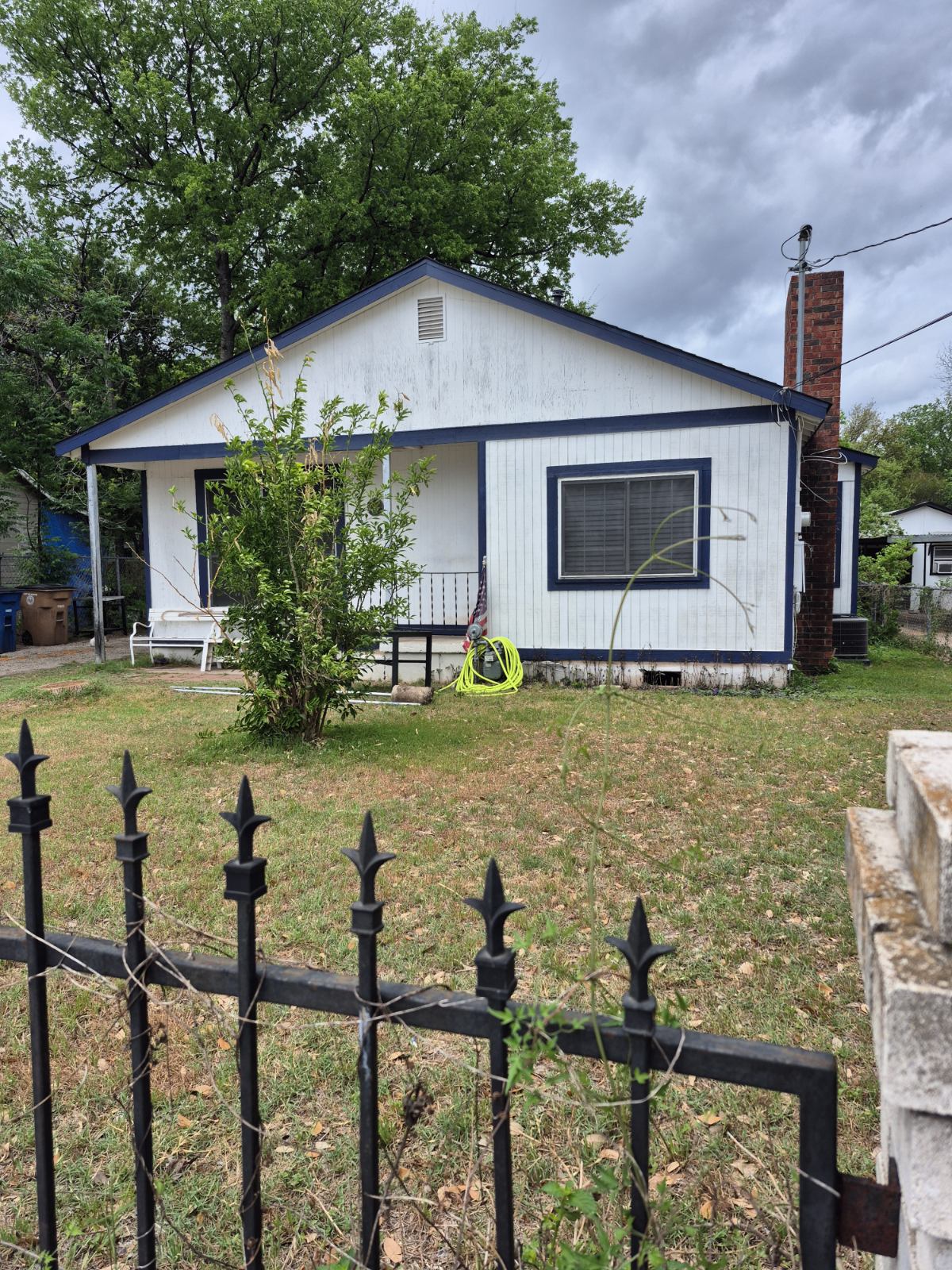 604 Springdale Road Austin, TX 78702 - Photo 2 of 5 View of front of property featuring a chimney and a porch