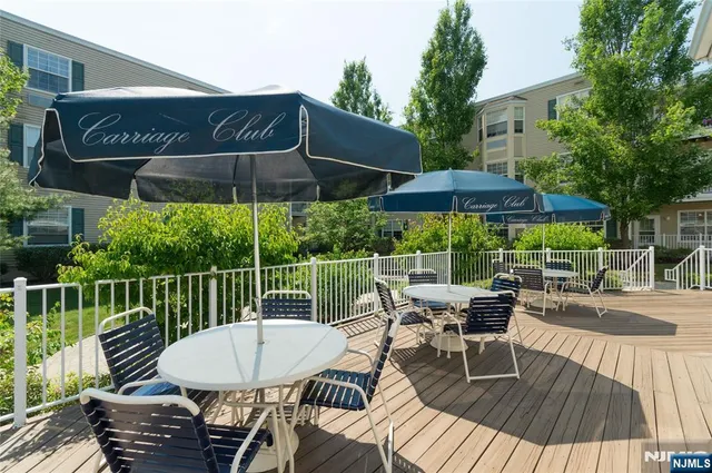 a view of balcony with outdoor seating and trees