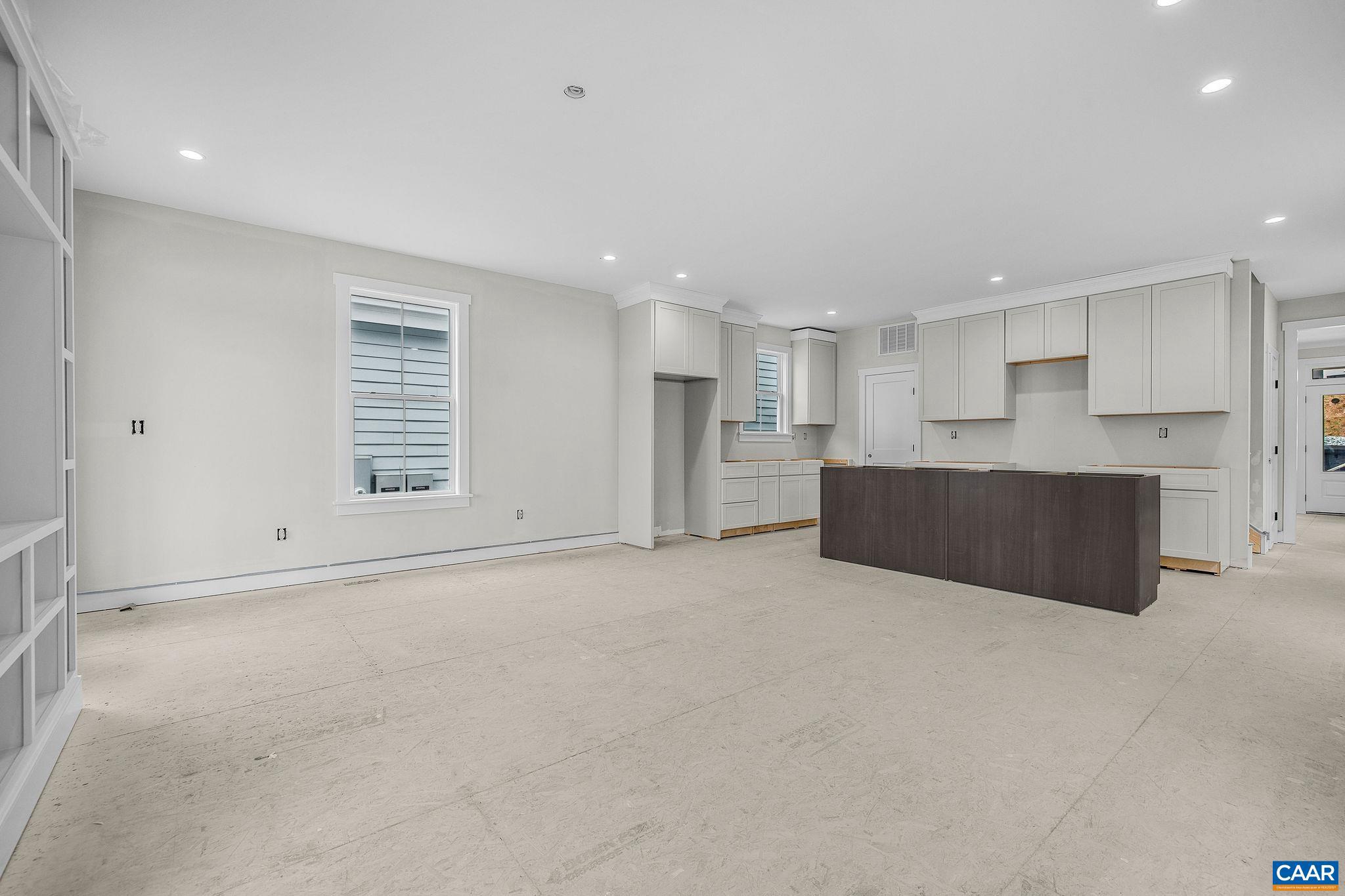 444 Nicholson Street Charlottesville, VA 22901 - Photo 14 of 26 a view of an empty room with a window and kitchen