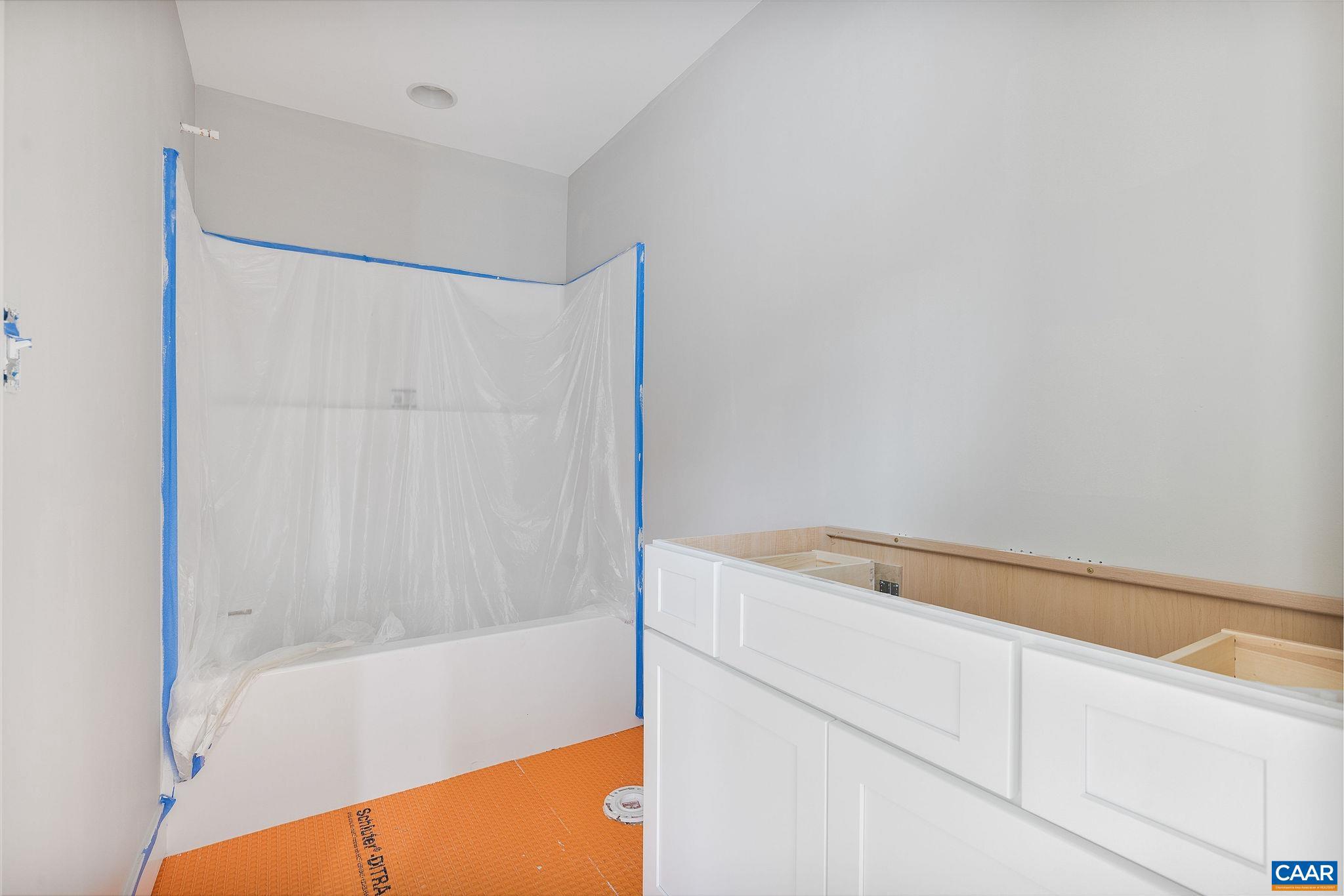 444 Nicholson Street Charlottesville, VA 22901 - Photo 19 of 26 a bathroom with a bathtub and a shower