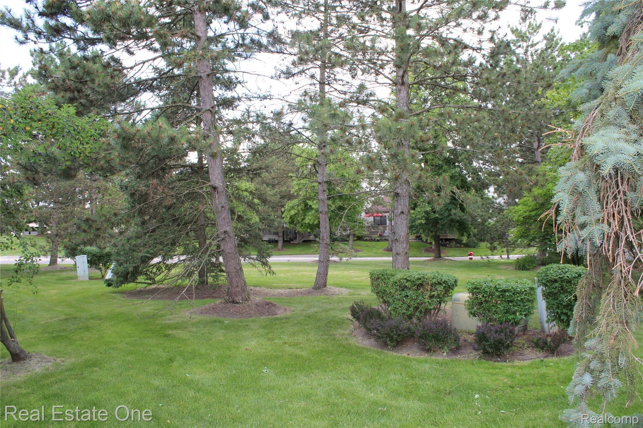 744 Eastbridge Court, Unit 103 Rochester, MI 48307 - Photo 20 of 23 Back Yard.JPG