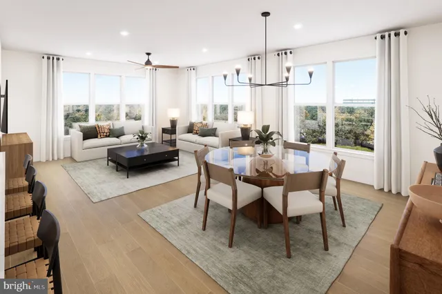 a kitchen with stainless steel appliances granite countertop a sink a stove a refrigerator and island with wooden floor