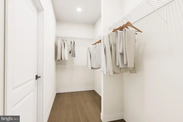 a bathroom with a double vanity sink and mirror