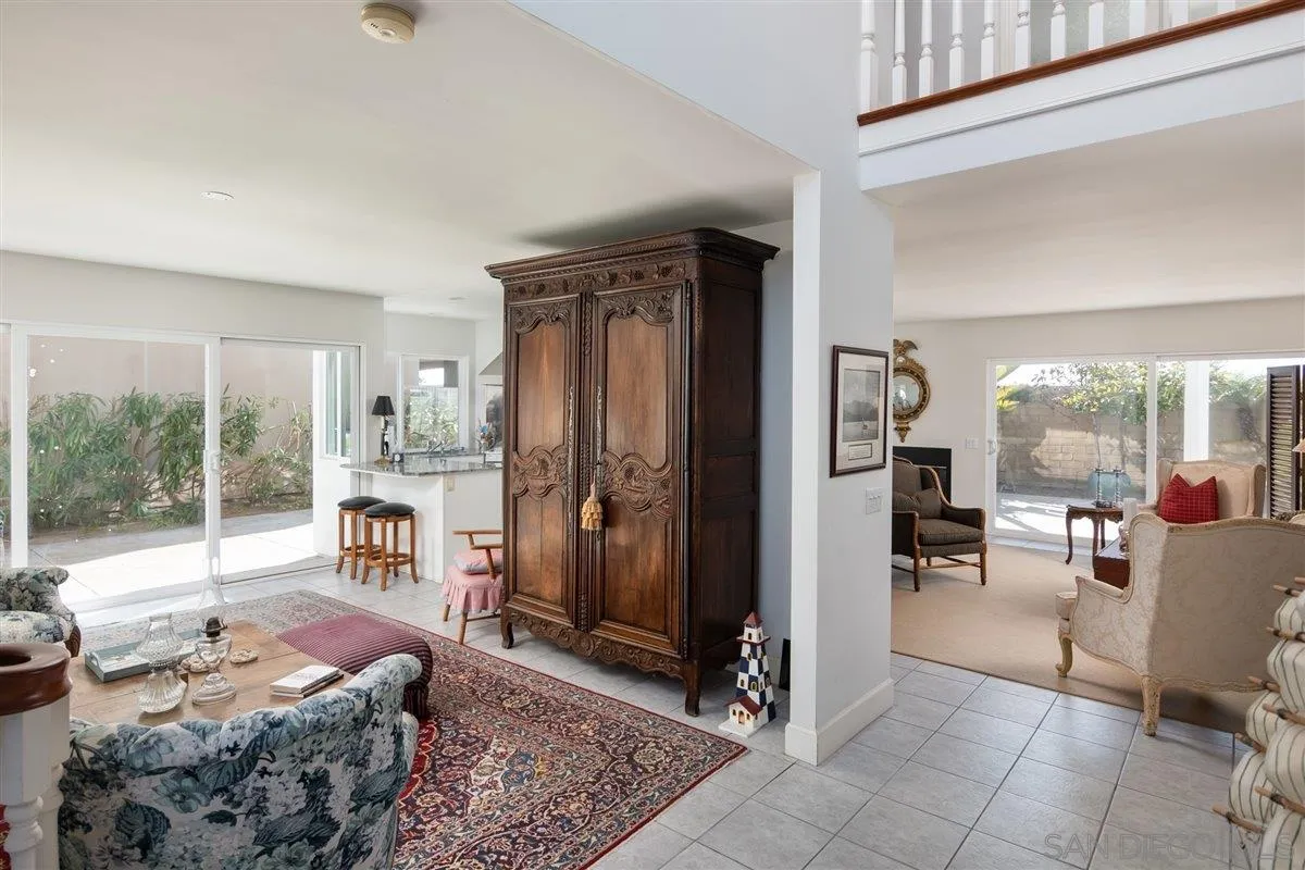 48 Half Moon Bend Coronado, CA 92118 - Photo 11 of 41 a living room with furniture and a floor to ceiling window
