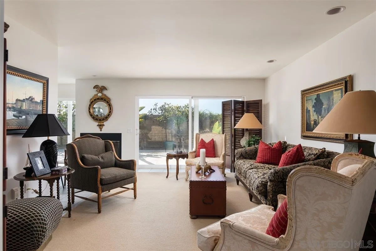 48 Half Moon Bend Coronado, CA 92118 - Photo 13 of 41 a living room with furniture a rug potted plant and a large window