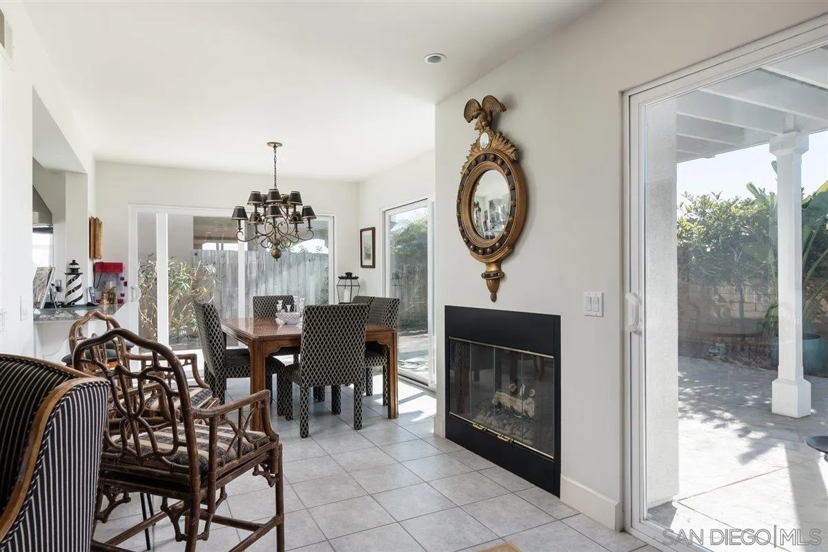 48 Half Moon Bend Coronado, CA 92118 - Photo 14 of 41 a view of a dining room and livingroom with furniture wooden floor a chandelier