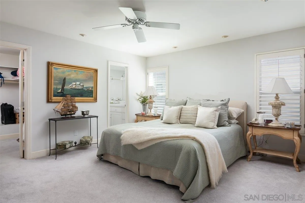 48 Half Moon Bend Coronado, CA 92118 - Photo 20 of 41 a bedroom with bed and a chandelier