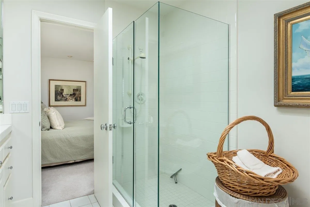 48 Half Moon Bend Coronado, CA 92118 - Photo 22 of 41 a bedroom with a bed and a painting on the wall