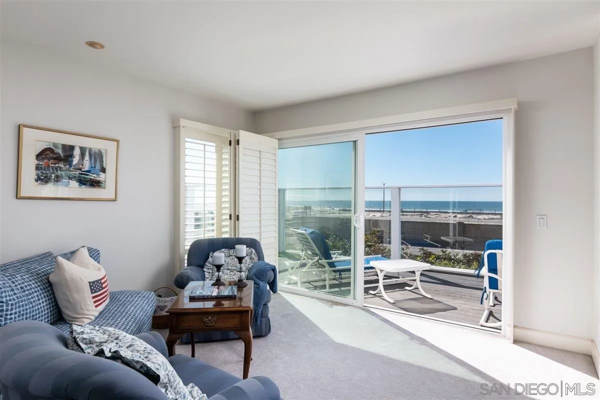 48 Half Moon Bend Coronado, CA 92118 - Photo 26 of 41 a living room with furniture or outdoor view and a potted plant