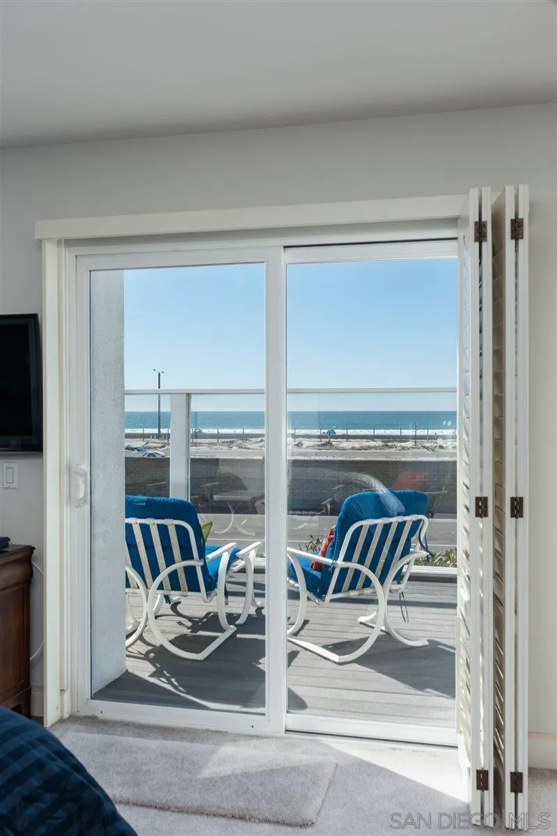 48 Half Moon Bend Coronado, CA 92118 - Photo 27 of 41 a living room with furniture and a floor to ceiling window