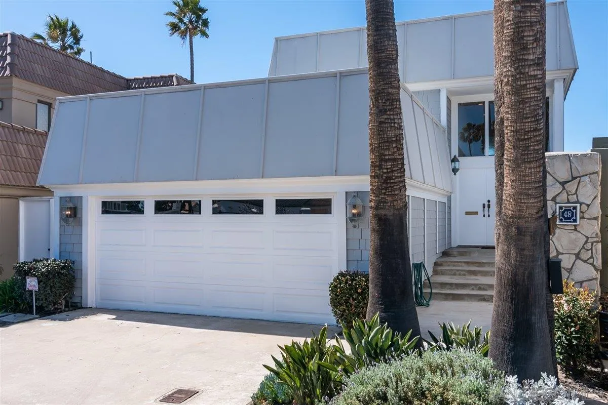 48 Half Moon Bend Coronado, CA 92118 - Photo 3 of 41 a front view of a house with a garden