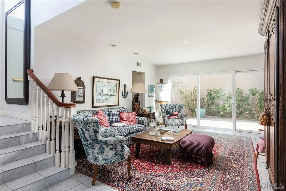 48 Half Moon Bend Coronado, CA 92118 - Photo 8 of 41 a living room with furniture and a floor to ceiling window