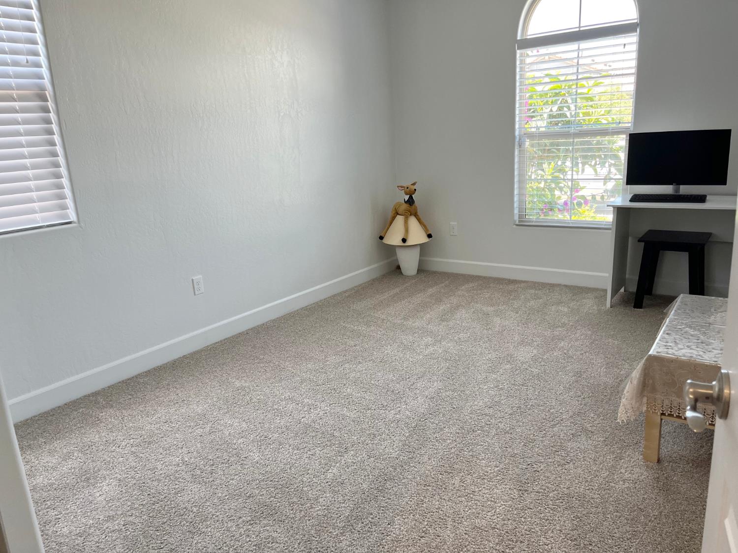 1405 West Tyler Court Visalia, CA 93291 - Photo 14 of 28 an empty room with windows