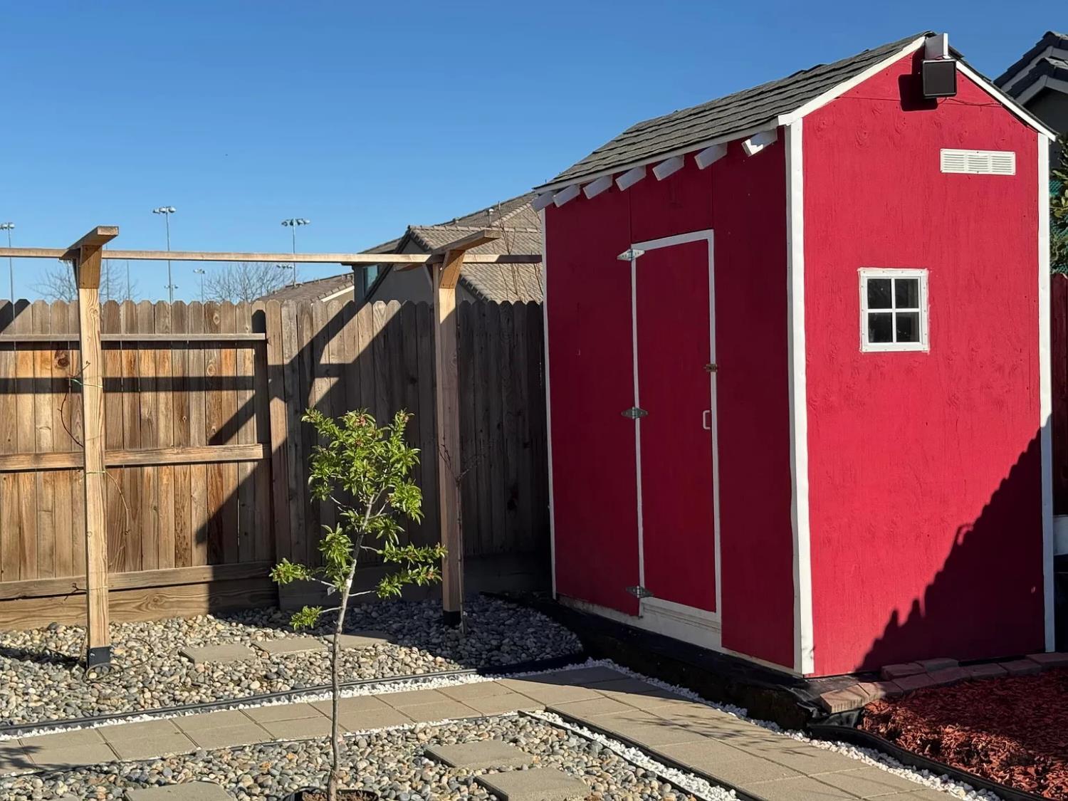1405 West Tyler Court Visalia, CA 93291 - Photo 23 of 28 a front view of a house with a yard