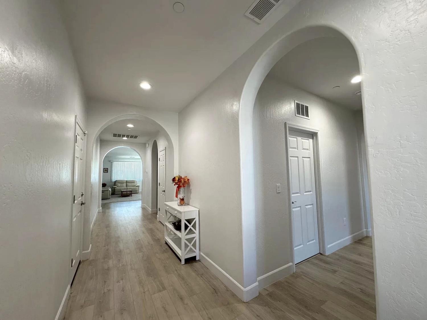 1405 West Tyler Court Visalia, CA 93291 - Photo 3 of 28 wooden floor with windows and closet in a room