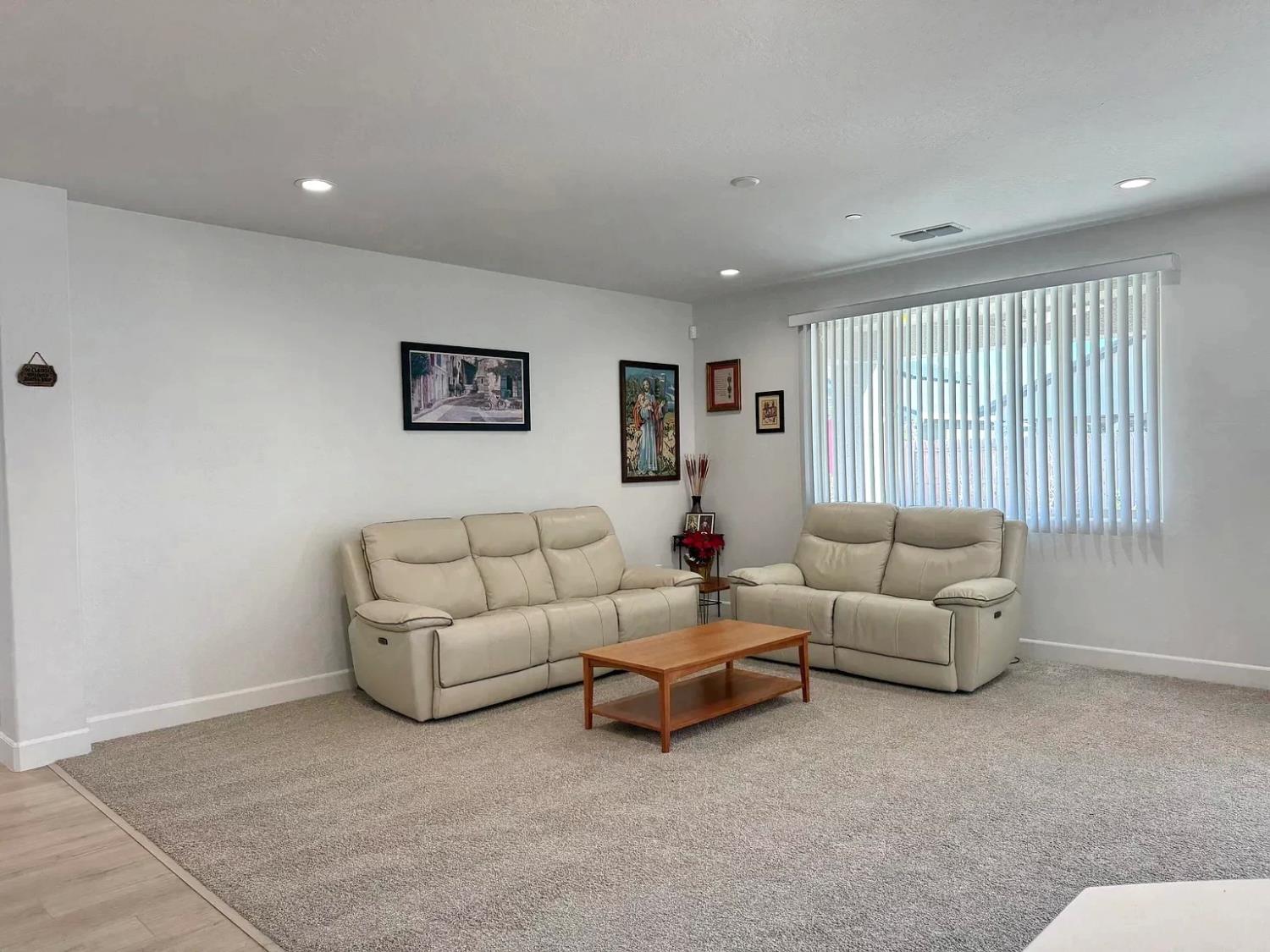 1405 West Tyler Court Visalia, CA 93291 - Photo 4 of 28 a living room with furniture and a large window