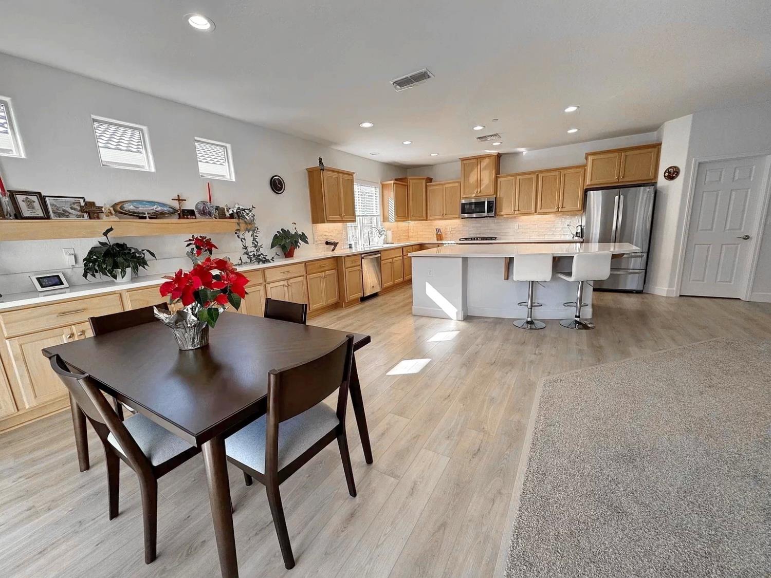 1405 West Tyler Court Visalia, CA 93291 - Photo 6 of 28 a living room with furniture kitchen and a table