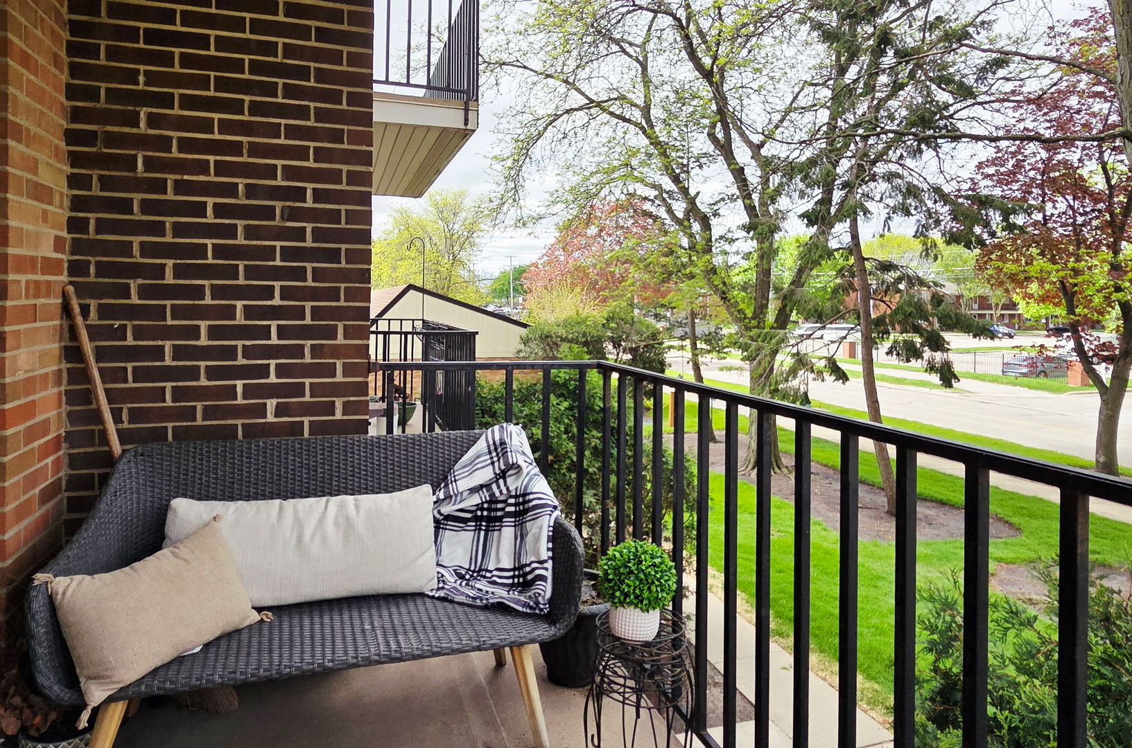 1217 South Old Wilke Road, Unit 201 Rolling Meadows, IL 60005 - Photo 8 of 26 a view of a balcony with a couch