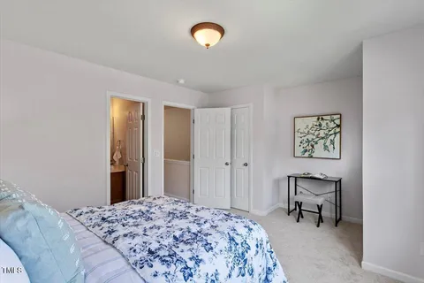 a bedroom with a bed and furniture