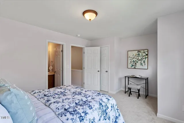 a bedroom with a bed and furniture