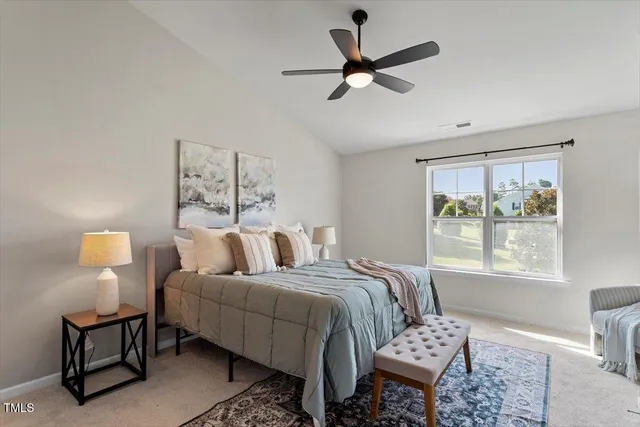 a bedroom with a bed furniture and window