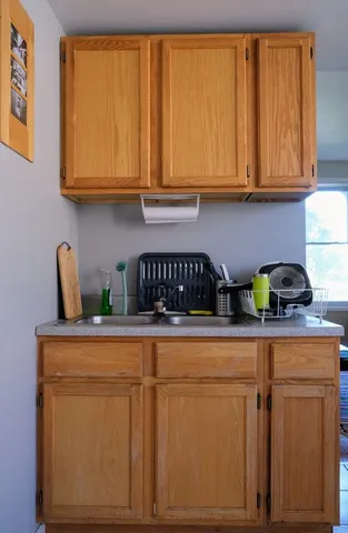 a kitchen with stainless steel appliances granite countertop a refrigerator sink and cabinets