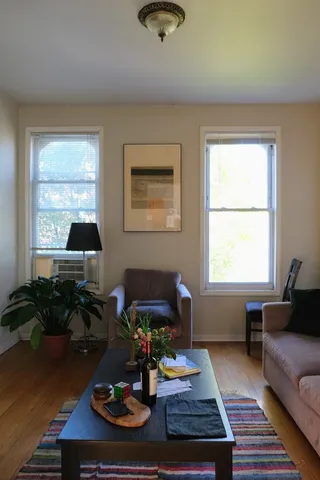 a living room with furniture and a window