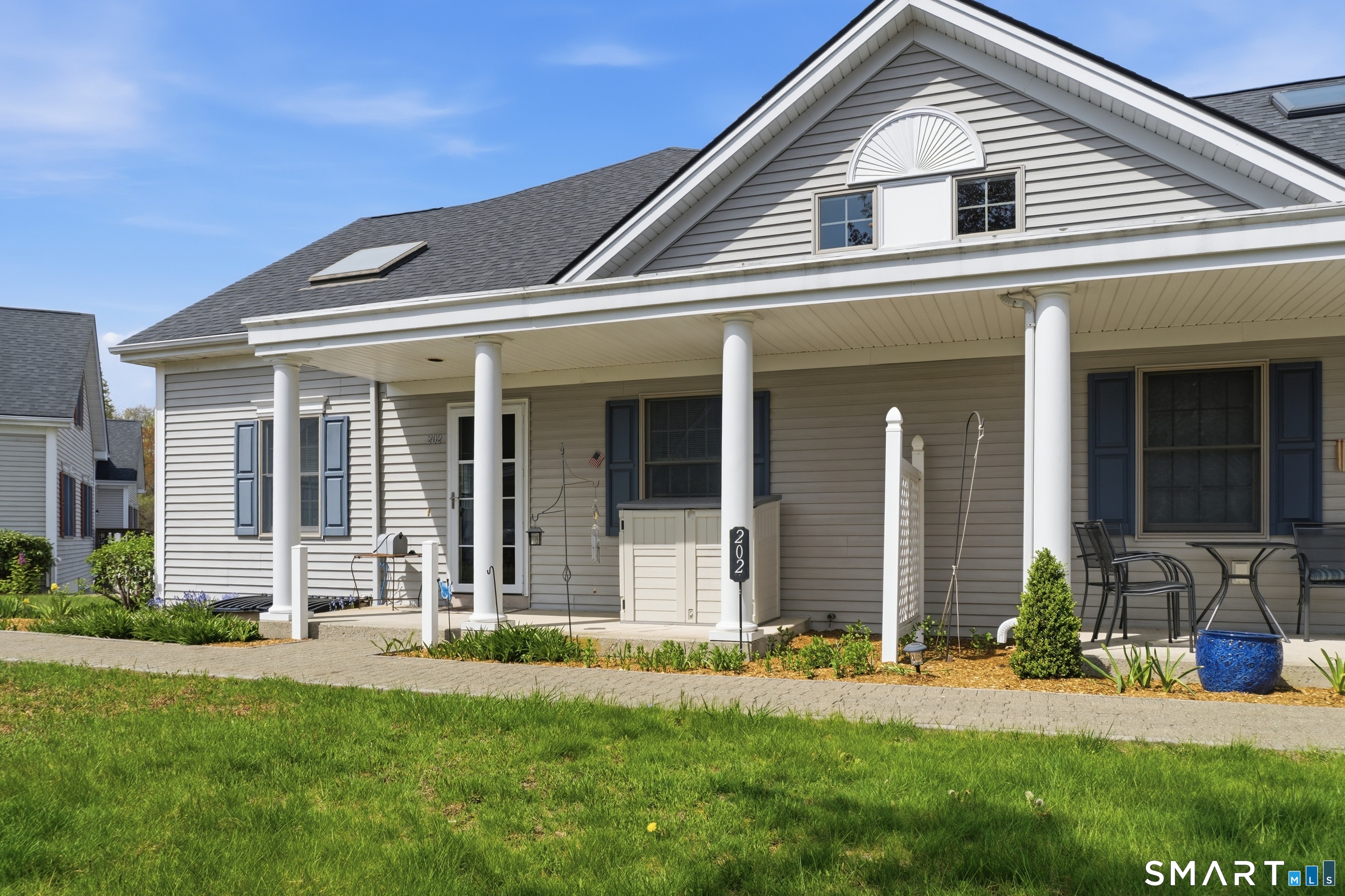 front view of a house with a yard