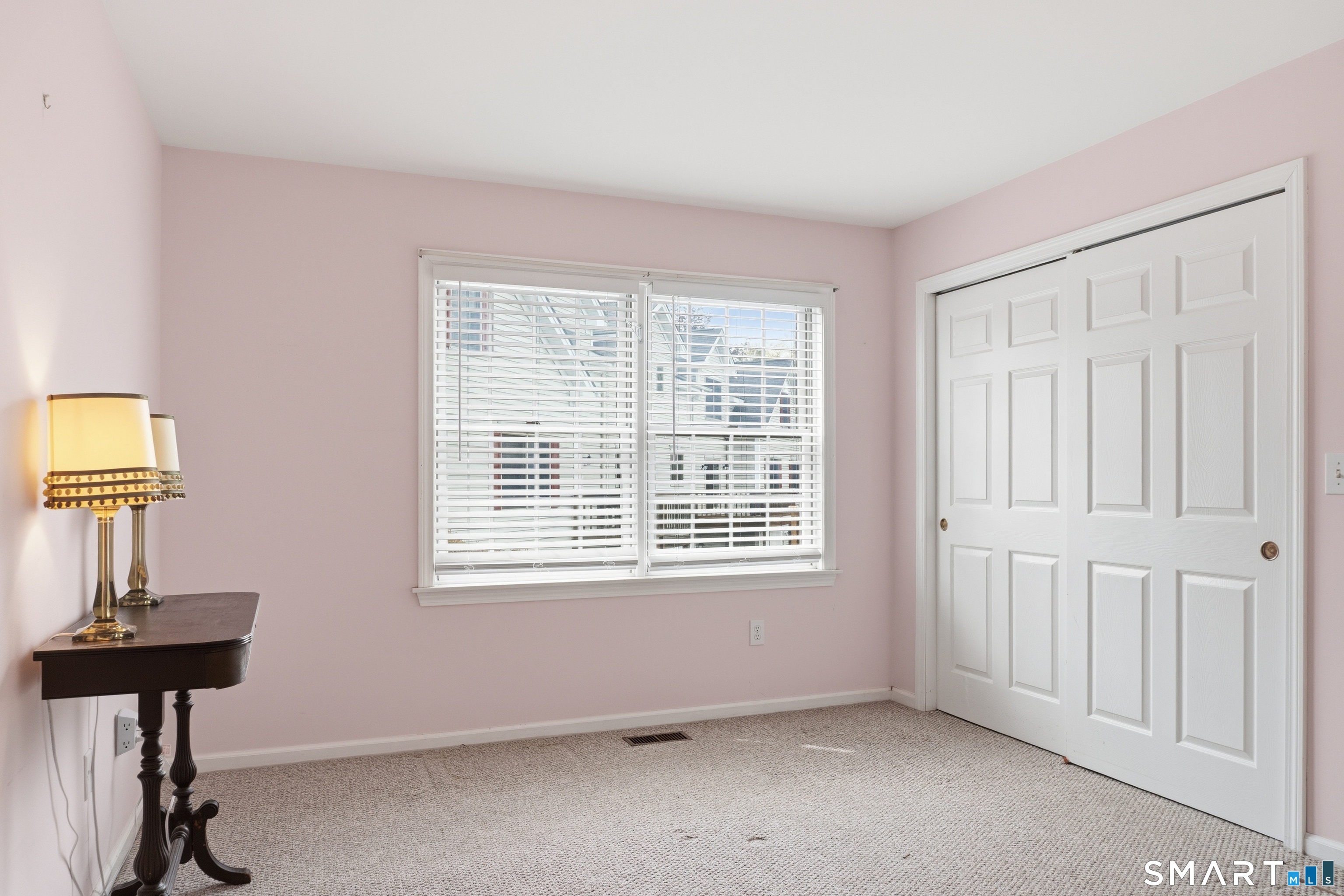 202 Stoney Way, Unit 202 New Fairfield, CT 06812 - Photo 8 of 18 a view of an empty room with a window