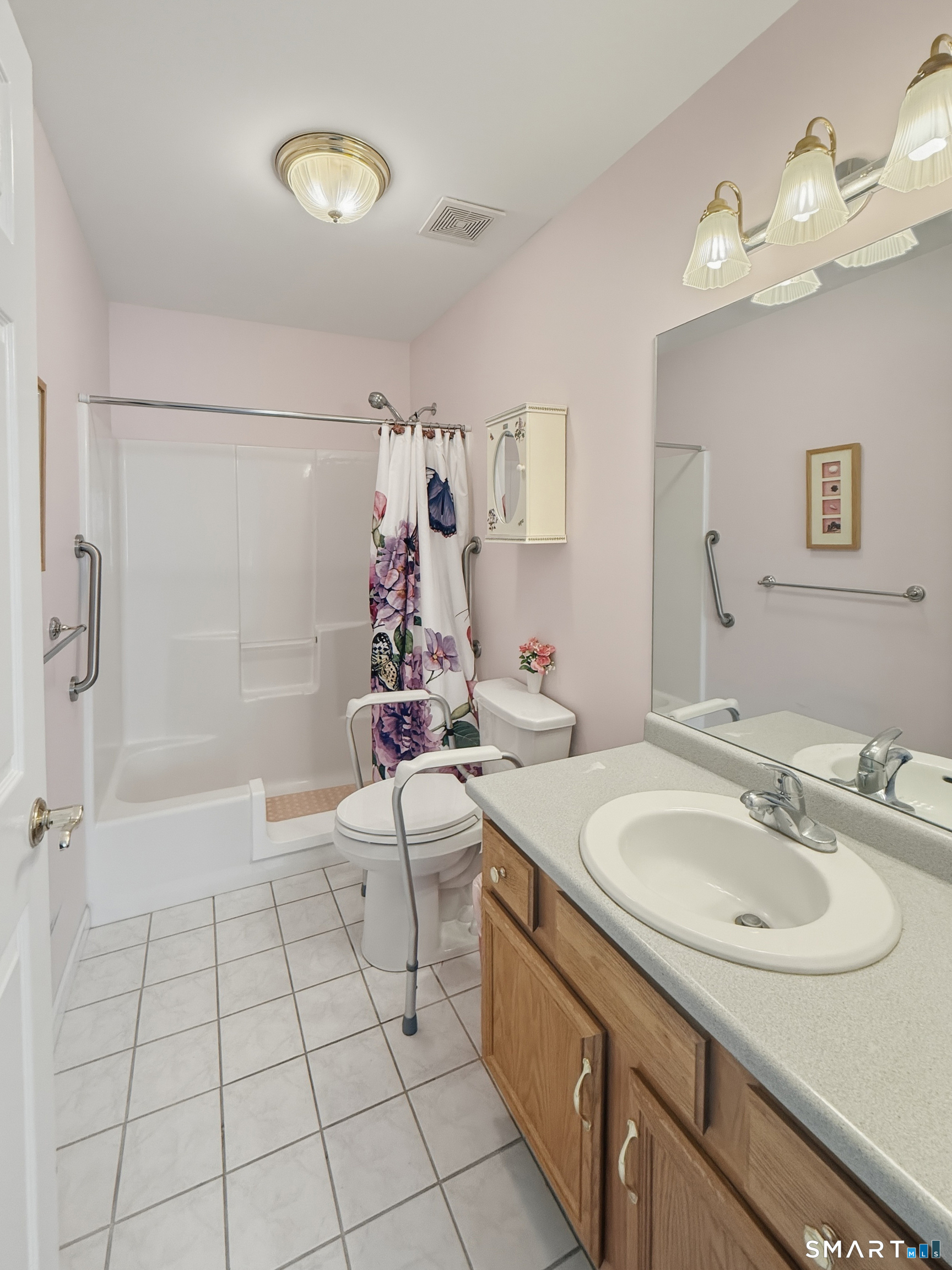 202 Stoney Way, Unit 202 New Fairfield, CT 06812 - Photo 9 of 18 a bathroom with a sink a toilet and shower
