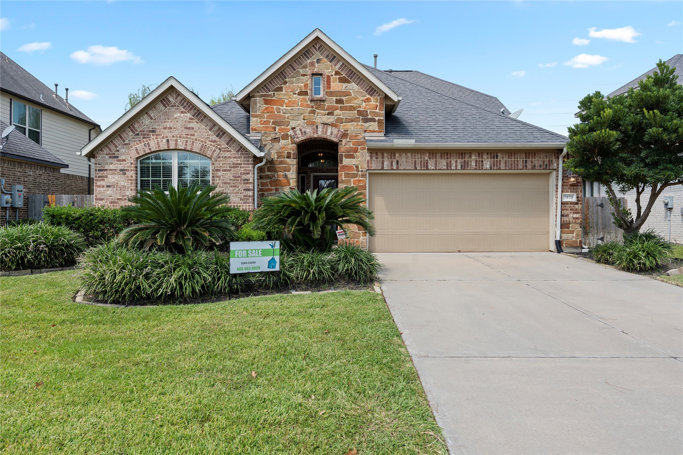 7423 Summer Night Lane Rosenberg, TX 77469 - Photo 1 of 44 a front view of a house with a garden and plants