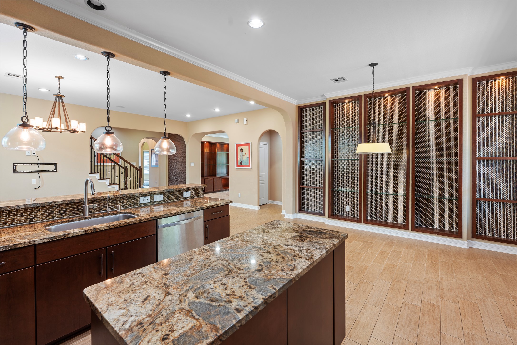 7423 Summer Night Lane Rosenberg, TX 77469 - Photo 22 of 44 a large kitchen with kitchen island a counter space a sink appliances and cabinets