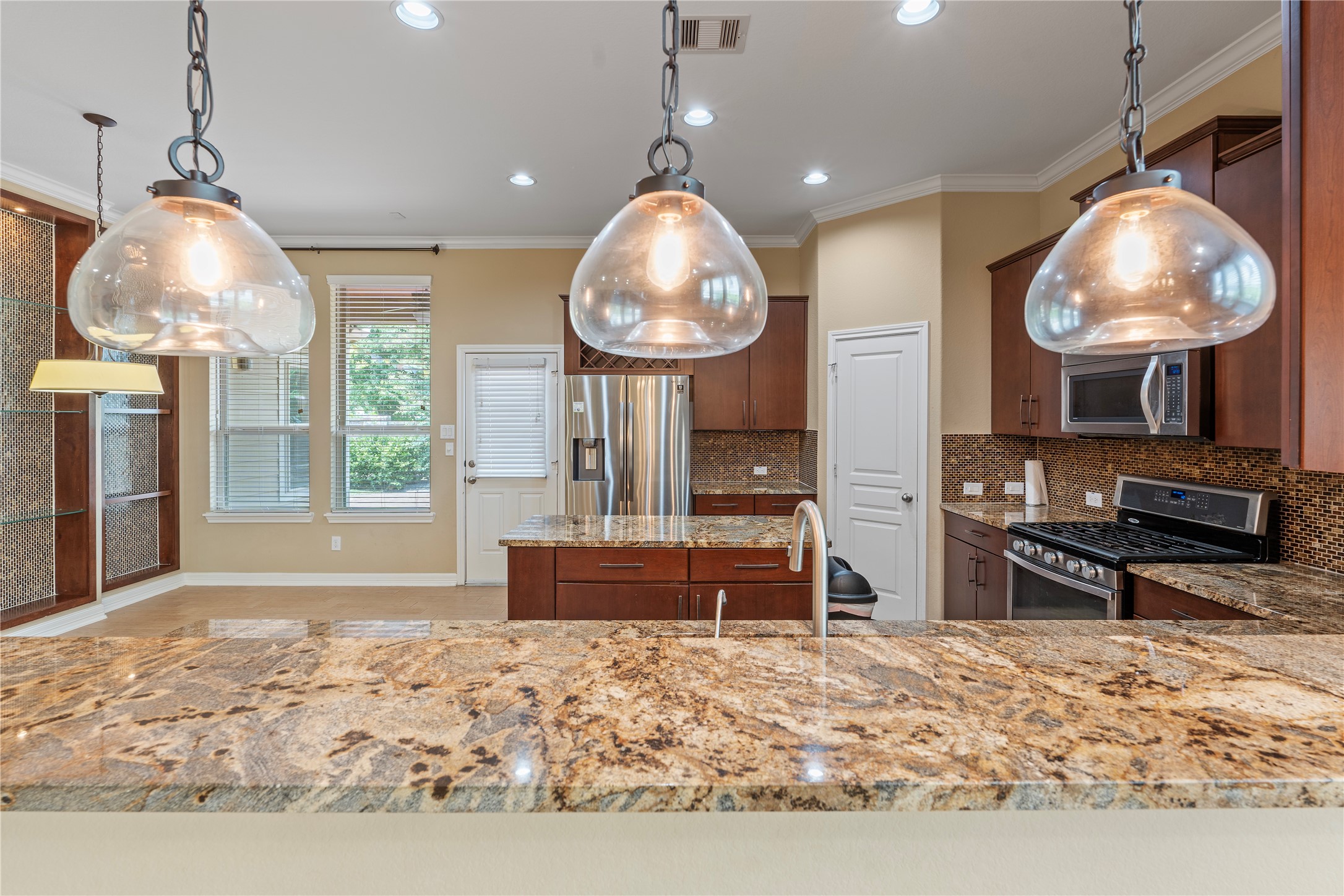 7423 Summer Night Lane Rosenberg, TX 77469 - Photo 23 of 44 a view of a dining room with furniture large windows and wooden floor