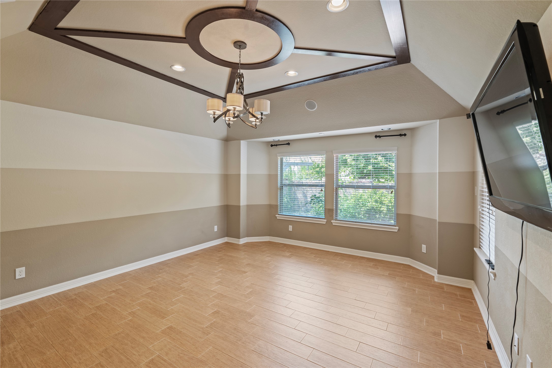 7423 Summer Night Lane Rosenberg, TX 77469 - Photo 25 of 44 an empty room with wooden floor fan and windows