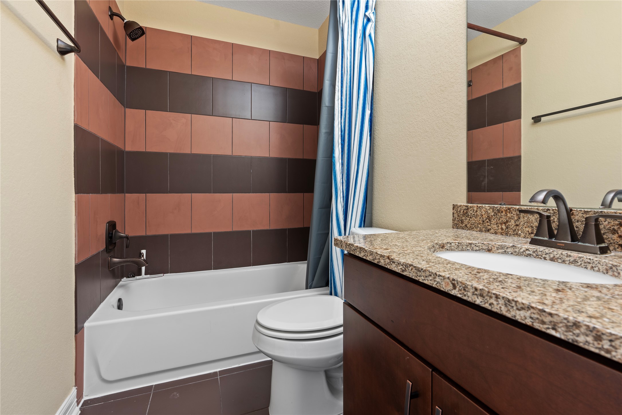 7423 Summer Night Lane Rosenberg, TX 77469 - Photo 37 of 44 a bathroom with a granite countertop sink a toilet and shower