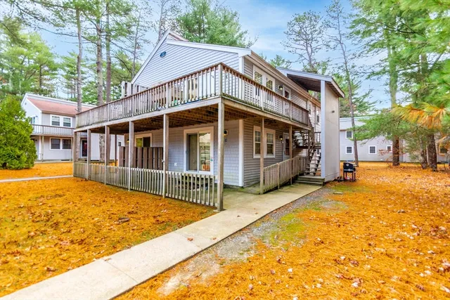 a view of swimming pool with house in the background