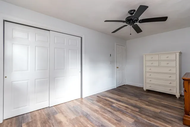 a view of a livingroom with closet and cabinet