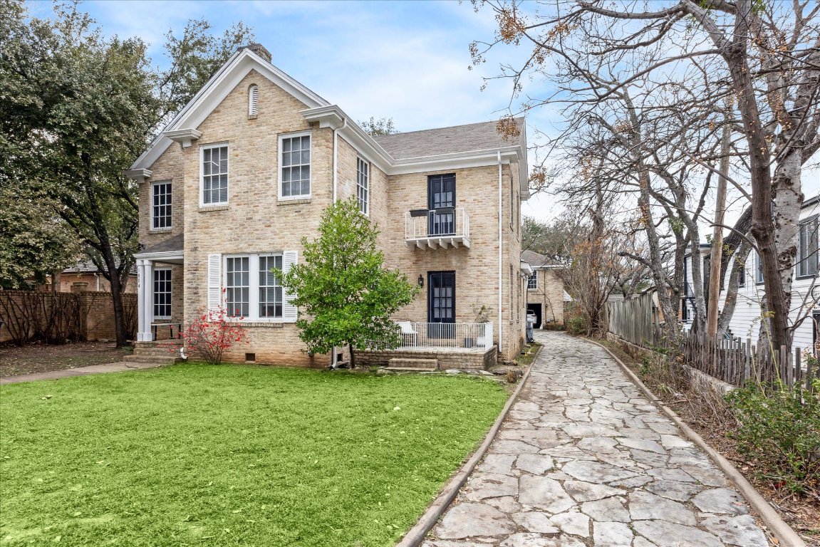 1804 Pearl Street Austin, TX 78701 - Photo 1 of 1 a front view of a house with a yard and trees