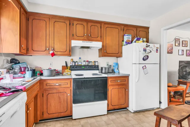 a kitchen with stainless steel appliances granite countertop a refrigerator sink and cabinets