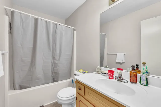 a bedroom with bed and a window