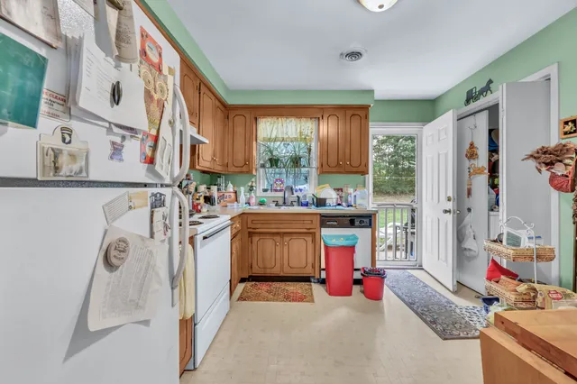 a utility room with cabinets dryer and washer