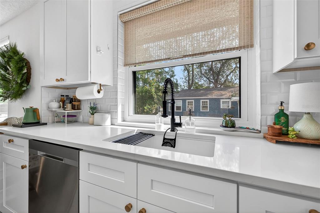 2220 7th Avenue North St. Petersburg, FL 33713 - Photo 14 of 31 a kitchen with a sink and a large window