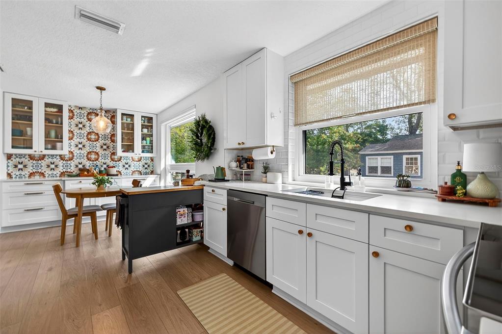 2220 7th Avenue North St. Petersburg, FL 33713 - Photo 15 of 31 a kitchen with a sink stove and cabinets