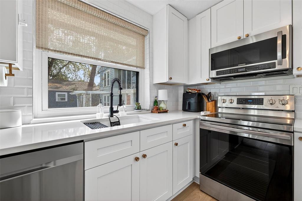 2220 7th Avenue North St. Petersburg, FL 33713 - Photo 16 of 31 a kitchen with a sink stove and microwave
