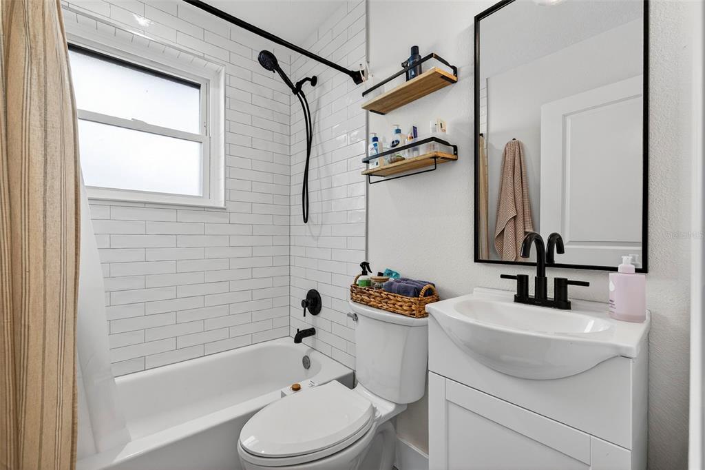 2220 7th Avenue North St. Petersburg, FL 33713 - Photo 18 of 31 a bathroom with a sink toilet and shower