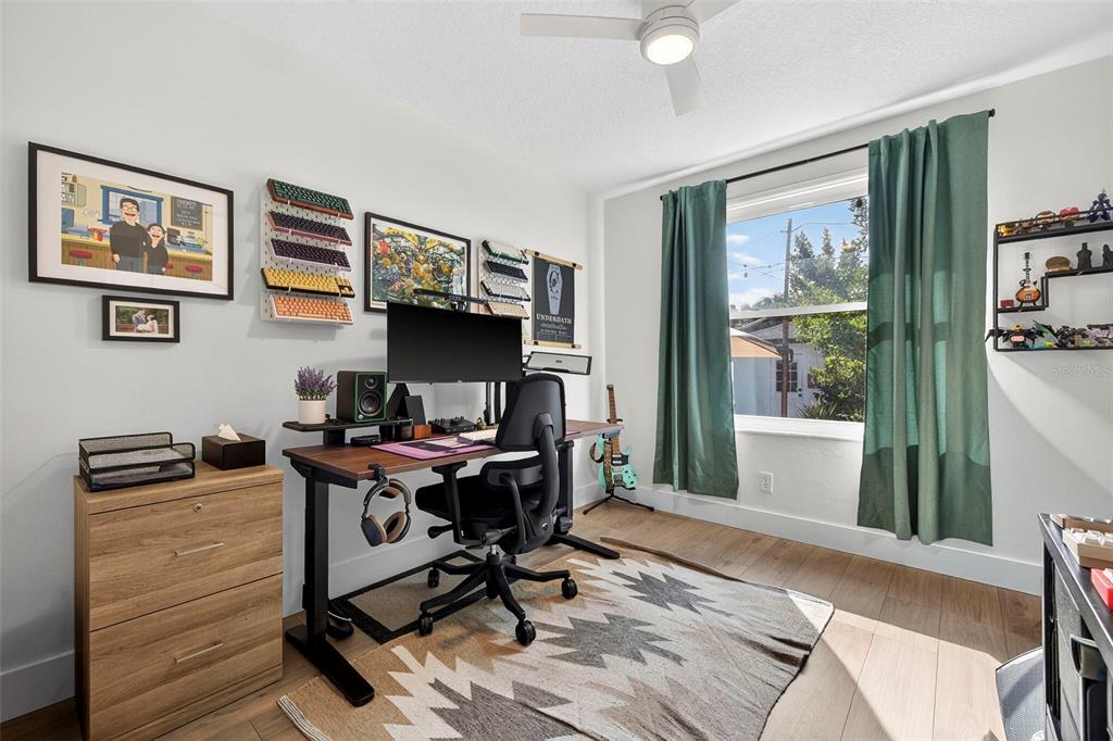2220 7th Avenue North St. Petersburg, FL 33713 - Photo 19 of 31 a view of a workspace with furniture and a window