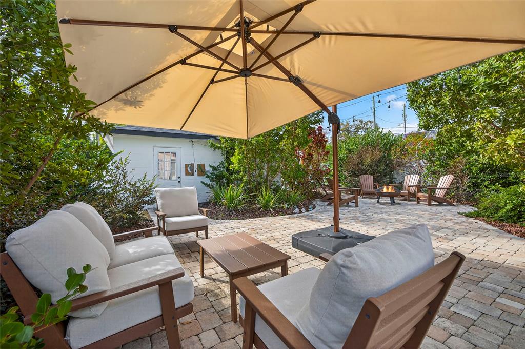 2220 7th Avenue North St. Petersburg, FL 33713 - Photo 24 of 31 a swimming pool with outdoor seating and plants