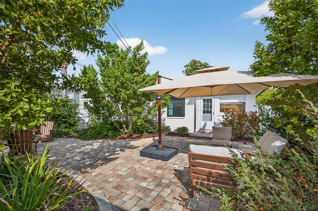 2220 7th Avenue North St. Petersburg, FL 33713 - Photo 30 of 31 a view of a patio with table and chairs under an umbrella