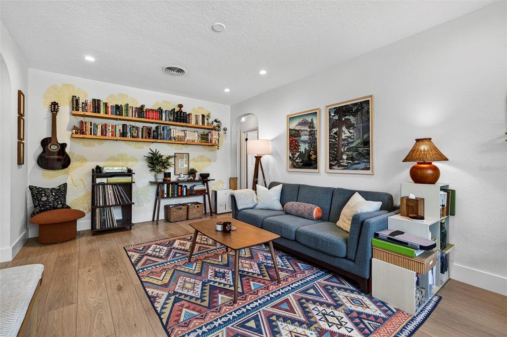 2220 7th Avenue North St. Petersburg, FL 33713 - Photo 5 of 31 a living room with furniture and a bookshelf